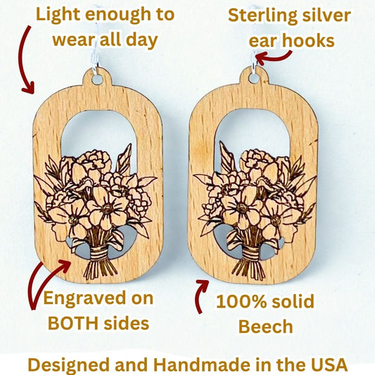 Infographic showing details and features of a pair of wooden earrings with a floral design. The earrings are made of 100% solid beech wood and feature sterling silver ear hooks. They are handmade in the USA and are light enough to wear all day. The earrings have an open, arched design with a detailed floral bouquet etched into the wood.