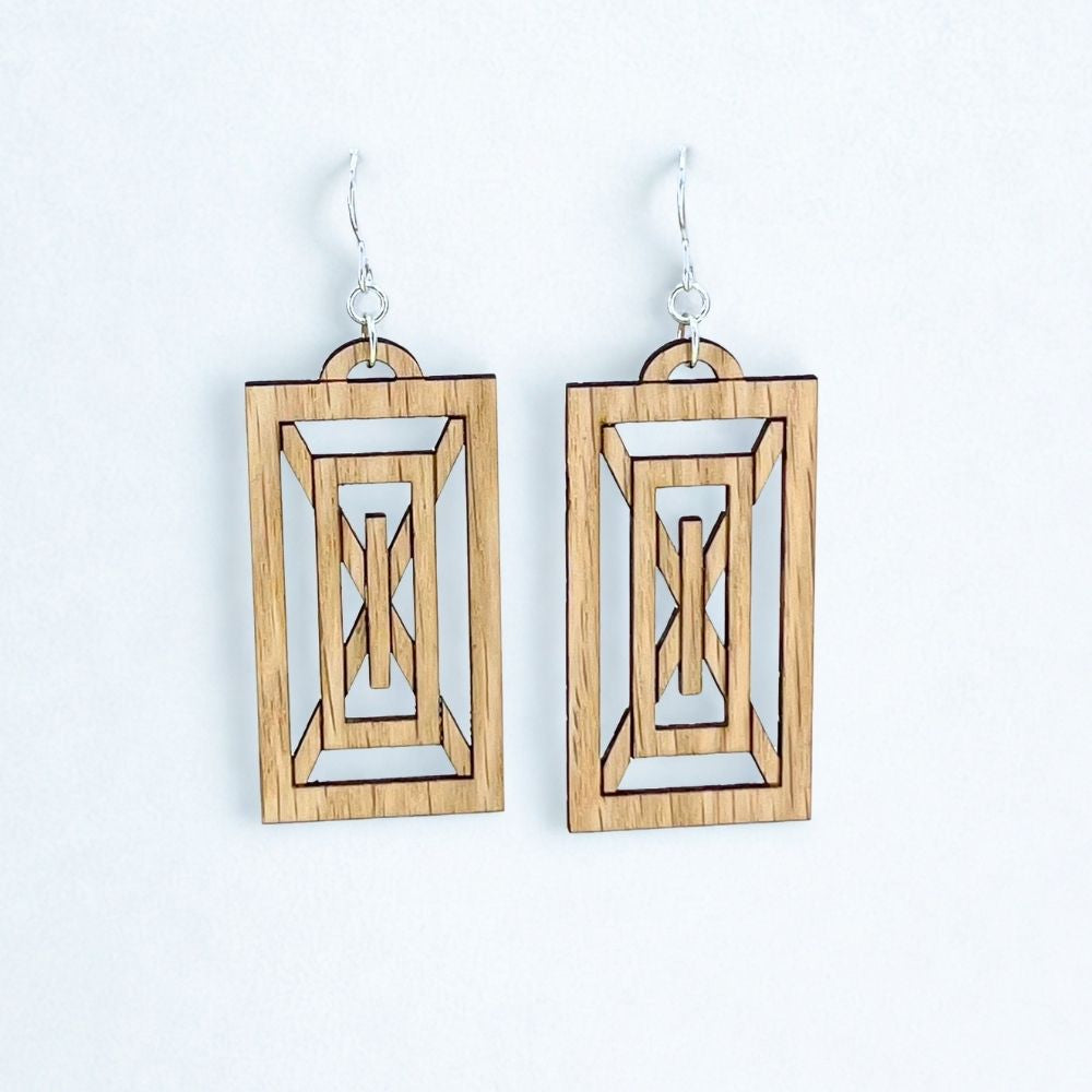 Sustainably produced Rectangular geometric art deco earrings made of red oak and recycled sterling silver  on a white background
