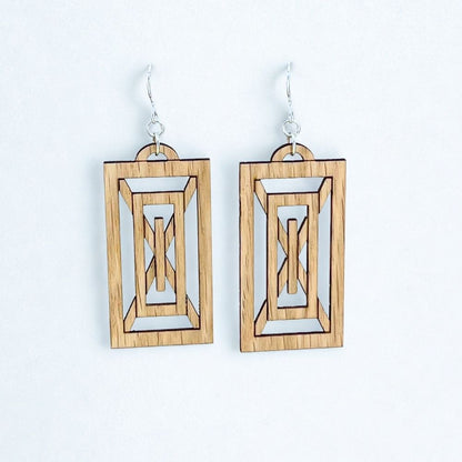 Sustainably produced Rectangular geometric art deco earrings made of red oak and recycled sterling silver  on a white background