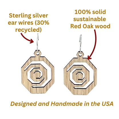 Octagonal red oak and recycled sterling silver earrings with labeled for material and origin, on a white background.