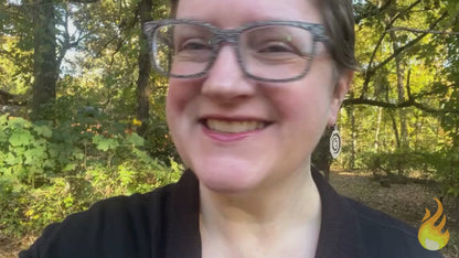 Video showing octagonal wooden red oak and sterling silver earrings being worn by a woman and then held in a hand on an earring card along with facts about its sustainability and that it is made in the USA.